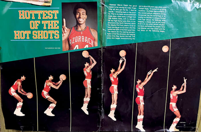 Former Arkansas assistant coach Matt Zimmerman's childhood wall featuring several basketball articles and a spread of former Razorback basketball star Marvin Delph.